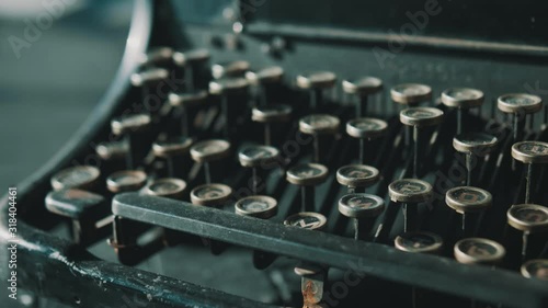 Closeup of old typewriter on black old floor photo