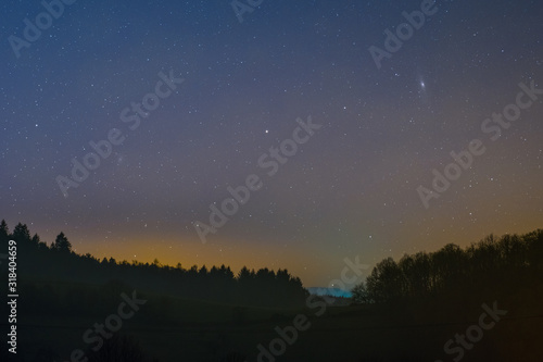 Night sky including the Triangulum and Andromeda Galaxy photographed from Lampenhain in the Odenwald in Germany.