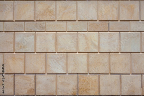 Wallpaper Mural Background image - the wall of the building, lined with stone tiles of different sizes Torontodigital.ca