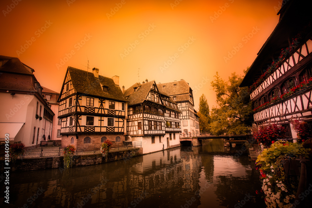 Strasbourg France with old half timbered homes and river at sunset