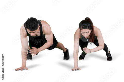 Young couple doing exercise by push up