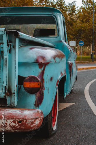 old blue pickup truck on the street. Classic car photo