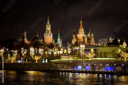Moscow Kremlin, St. Basil’s Cathedral and Zaryadye Park across the Moscow River. The embankment of the river and the streets are decorated for the new year 2020