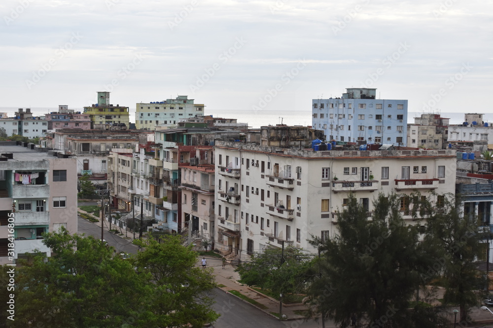 cityscape of colorful buildings in Vedado Havana along el Malecon