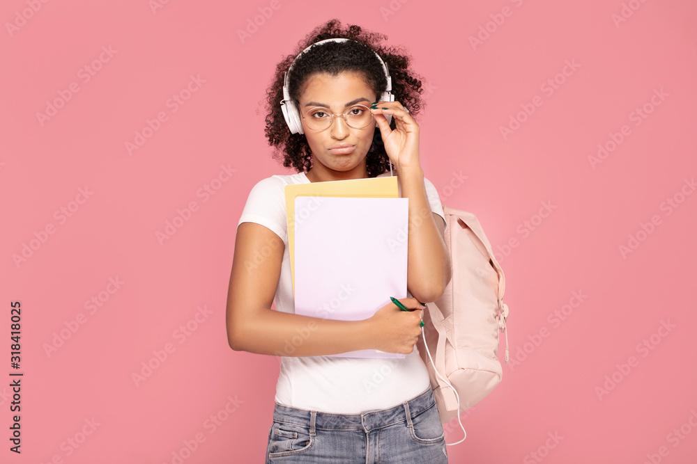 Sad student girl with backpack and notebooks. Sad student girl with backpack and notebooks.