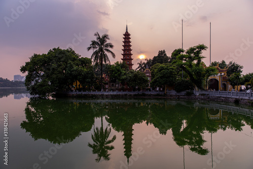 Scenic view at Tran Quoc Pagoda at sunset time, Hano, Vietnam. Tran Quoc Pagoda is the oldest Buddhist temple in Hanoi, located on a small island on West Lake.