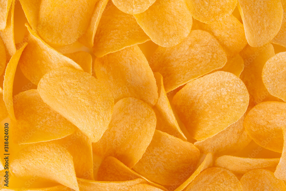 Chips. Crispy potato. Snack texture background. Top view. Сloseup. Chips. Crispy potato. Snack texture background. Top view. Сloseup.