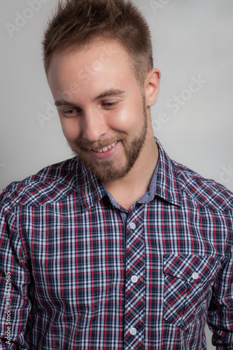 Handsome young elegant man studio portrait.