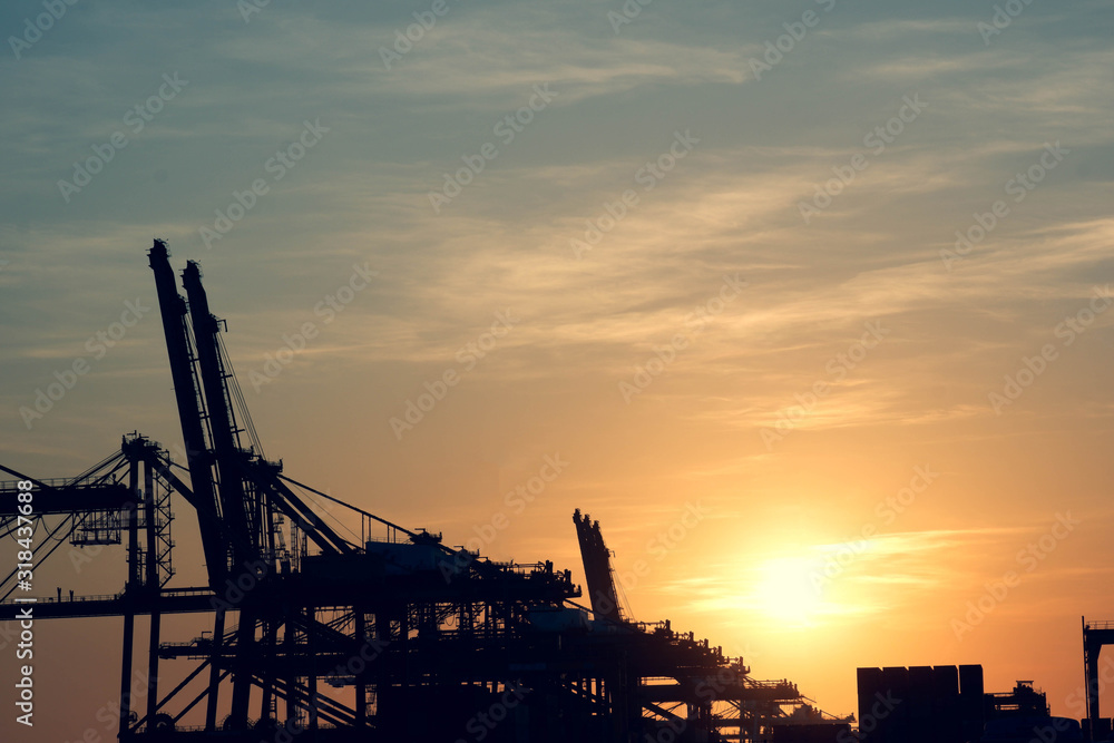 Fototapeta premium Loader cranes Evening view Concept of export