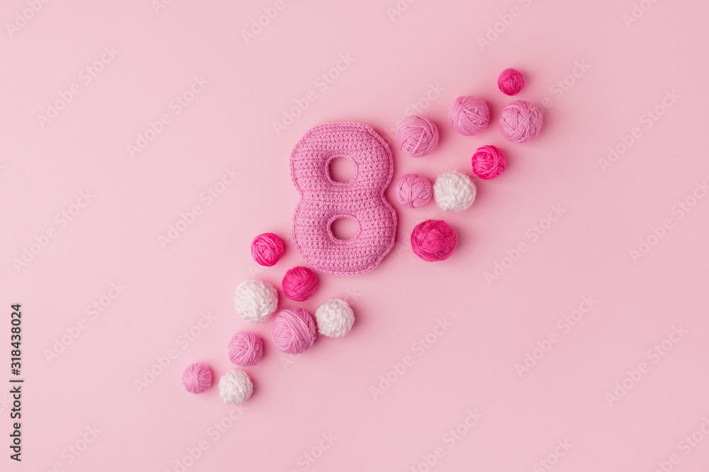 Happy International Women’s Day celebrate on March 8, congratulatory CARD. Handmade crocheting pink Number eight and yarn ball, minimal concept for seasonal holiday or girl birthday party, copy space Happy International Women’s Day celebrate on March 8, congratulatory CARD. Handmade crocheting pink Number eight and yarn ball, minimal concept for seasonal holiday or girl birthday party, copy space
