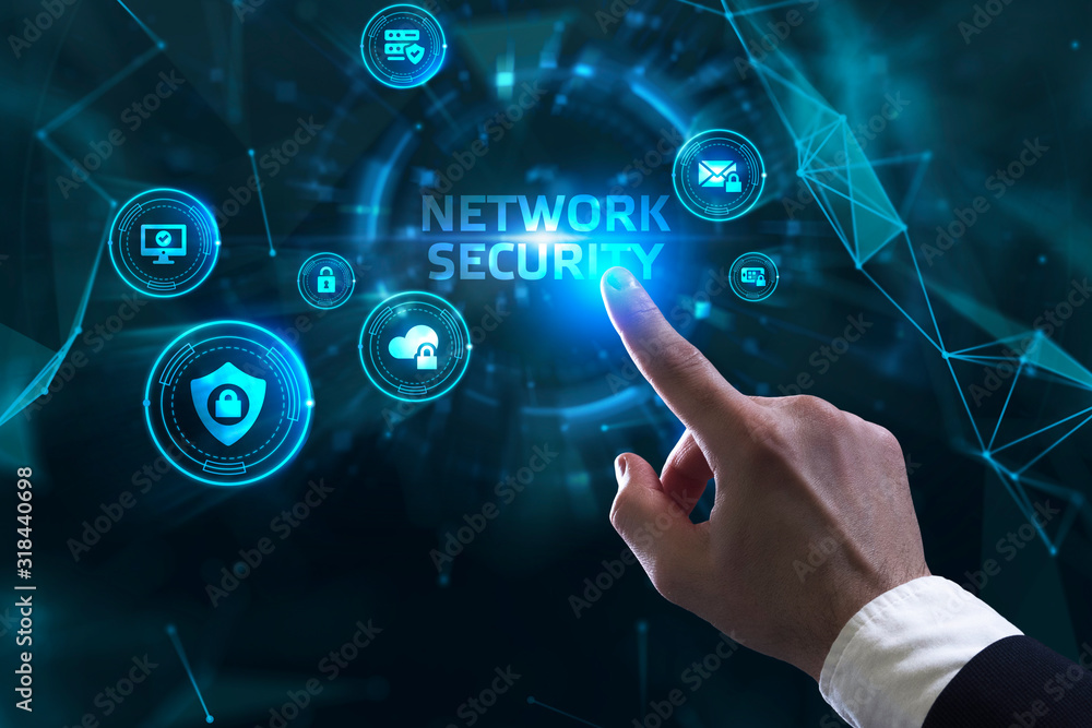 Business, technology, internet and networking concept. Young businessman working in the office, select the icon Network security on the virtual display. Business, technology, internet and networking concept. Young businessman working in the office, select the icon Network security on the virtual display.