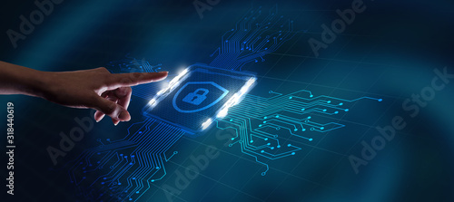 Cyber security data protection business technology privacy concept. Young businessman  select the icon security on the virtual display. © putilov_denis