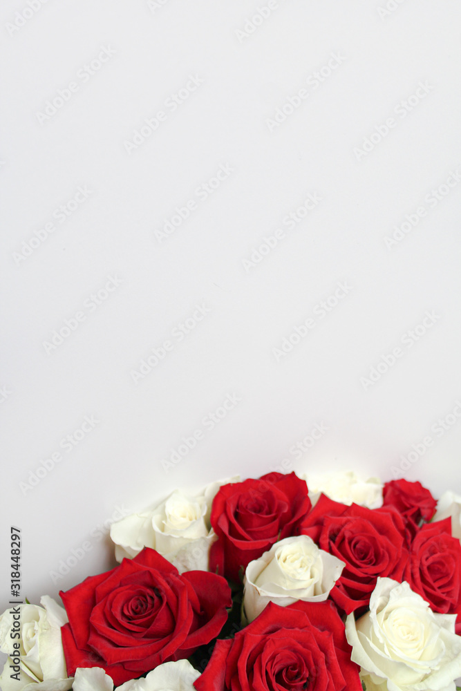 Bunch of red and white roses on blank surface with copy space for text. Backdrop for Saint Valentine's Day, International Women's Day, Mother's Day. Romantic greeting card, poster, invitation template Bunch of red and white roses on blank surface with copy space for text. Backdrop for Saint Valentine's Day, International Women's Day, Mother's Day. Romantic greeting card, poster, invitation template