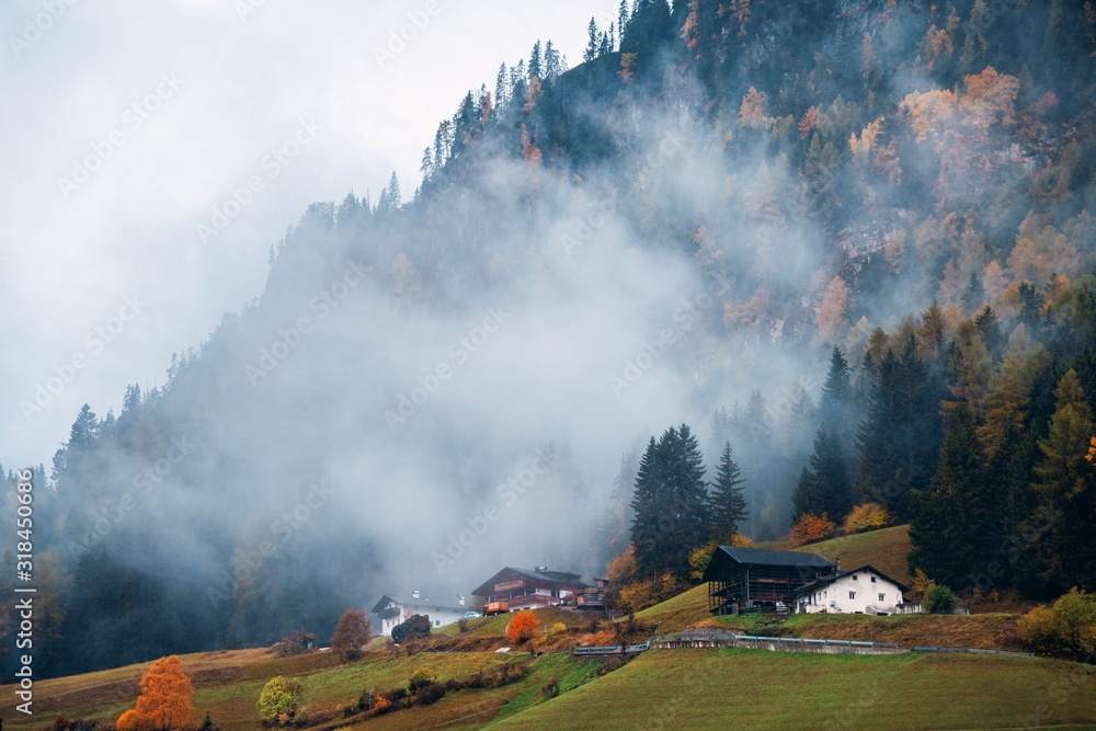 Obraz premium Dolomites fog color foliage house