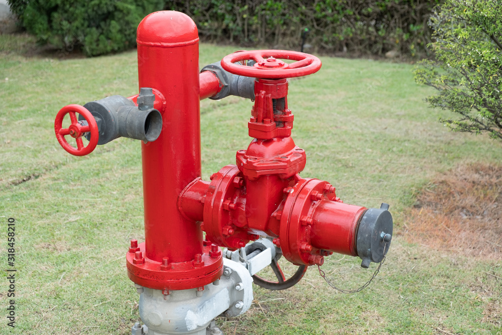 fire extinguisher installed on the grass fire extinguisher installed on the grass