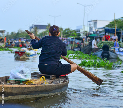 Fototapeta Naklejka Na Ścianę i Meble -  Rowing wooden boat on Mekong River