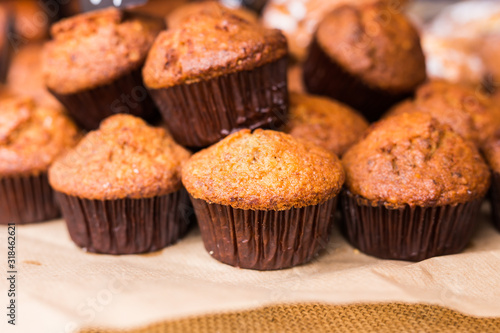 Pastry shop with chocolate cupcakes, close up