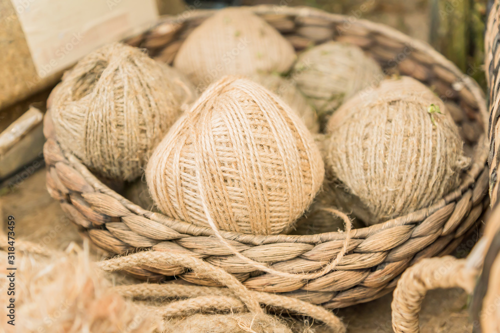 many skeins in a basket made of hemp. Fiber production.