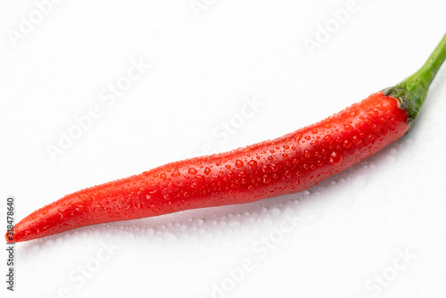 Fresh red chili pepper on isolated white