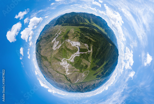 Aerial panoramic view of planet earth near a Chike-Taman pass in the Altai mountains with green trees, Blue sky and clouds. Full VR 360 Degree Aerial Panorama Seamless Spherical