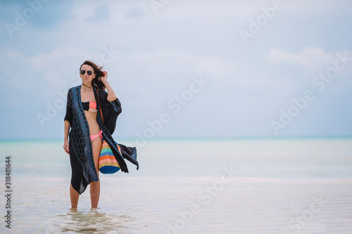 Young beautiful woman on the beach vacation