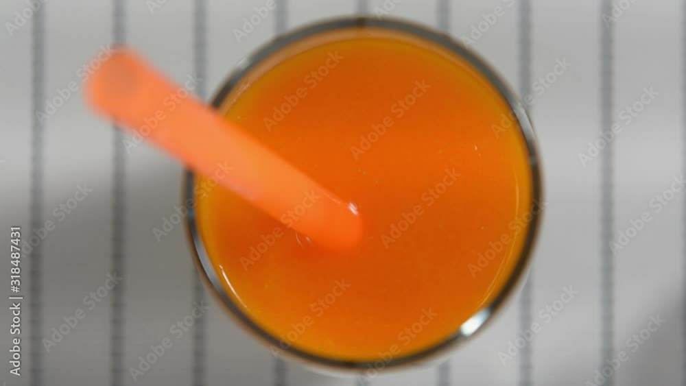 carrot smoothies in a glass. Dip a smoothie into an orange smoothie. carrot smoothies in a glass. Dip a smoothie into an orange smoothie.