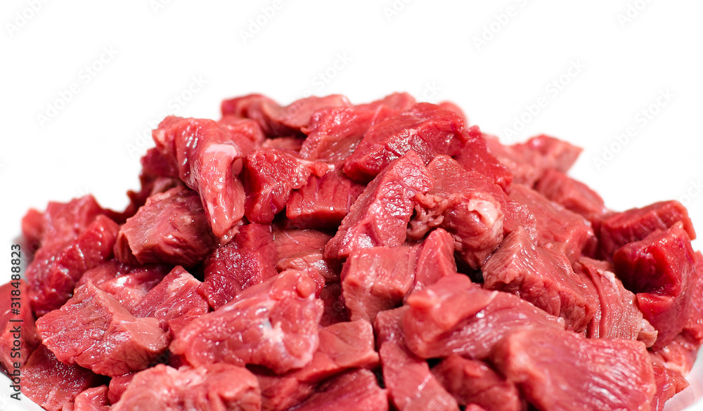 Slices of fresh beef meat on a white background, closeup, isolated, ingredient for cooking Slices of fresh beef meat on a white background, closeup, isolated, ingredient for cooking