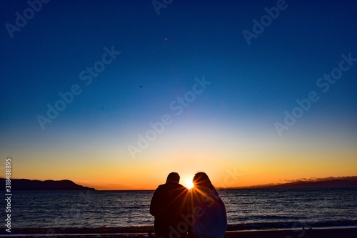 people take a long look at sunset