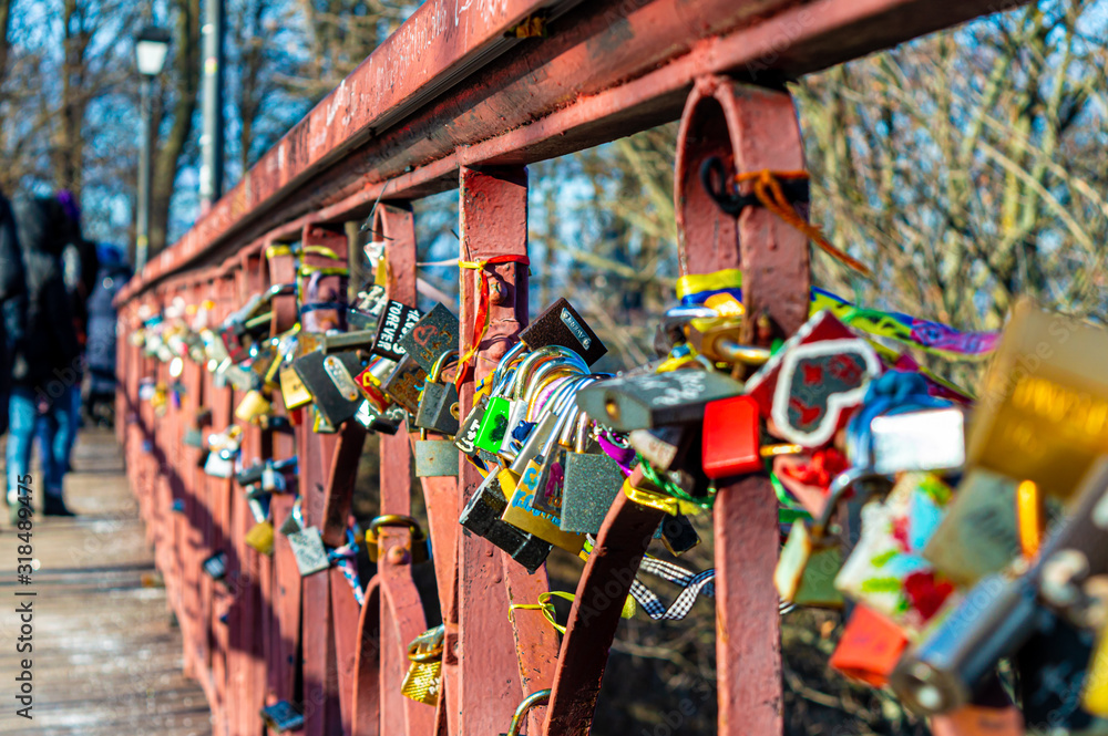 Naklejka premium Parkovy Bridge with lot of love locks designed by Paton in Kyiv, Ukraine on January 12, 2020. 