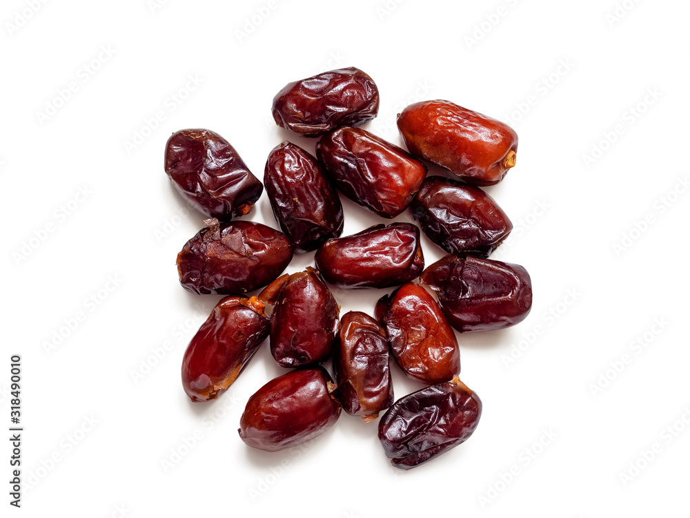 Handful of dried dates on a white background Handful of dried dates on a white background