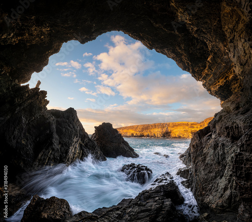 Caves at the ocean cliff in Monumento Natural de las Cuevas de Ajuy National Park photo