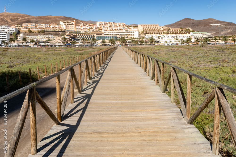 wooden bridge running from the beach to Morro Jable - Fuerteventura