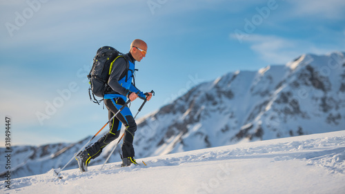 Uphill with skis and seal skins on the Alps photo