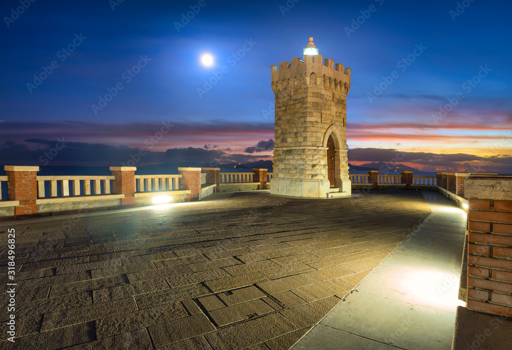 Piombino piazza bovio lighthouse and Elba Island and moonlight. Tuscany Italy