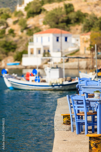 Open cafe outdoor restaurant in Greece on sea shore