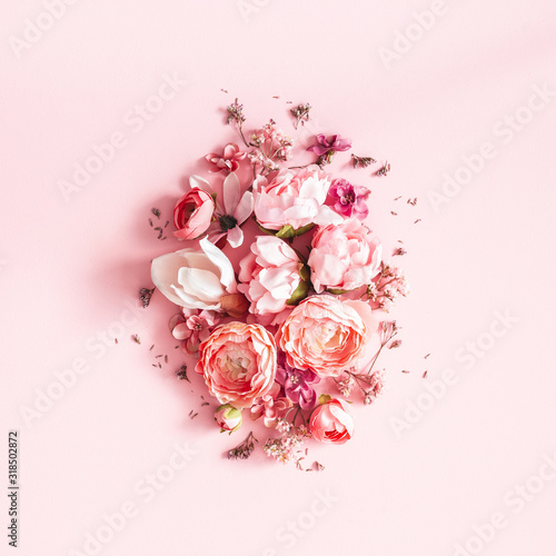 Flowers composition. Pink flowers on pastel pink background. Valentines day, mothers day, womens day concept. Flat lay, top view