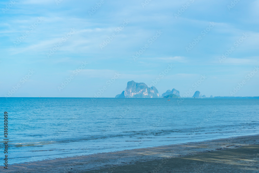Light blue sky and islands in the background at Hat Chao Mai National Park, Trang, Thailand.