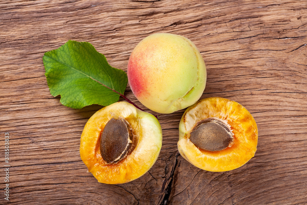 apricots on a dark wooden background. toning. selective focus