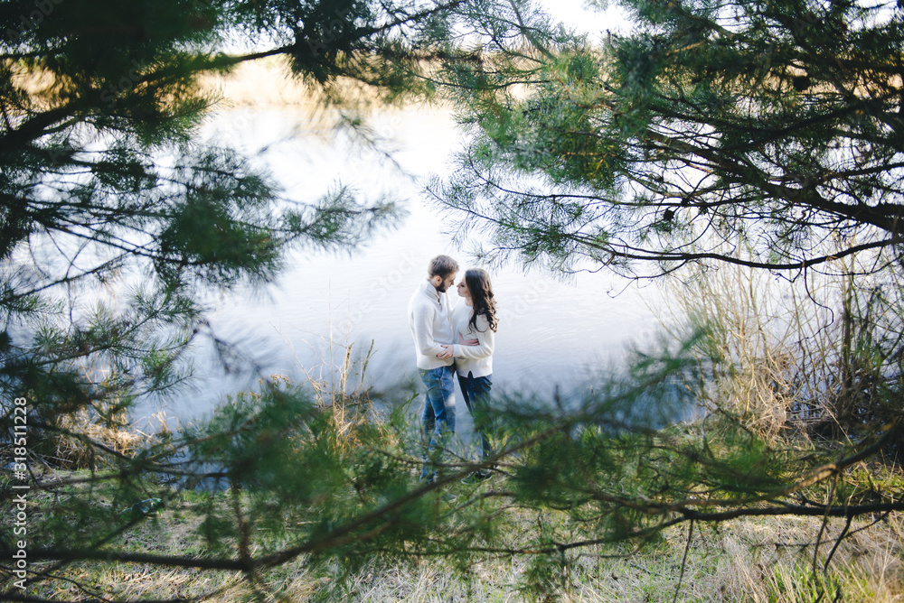 Happy girl and guy on the river, travel love story concept