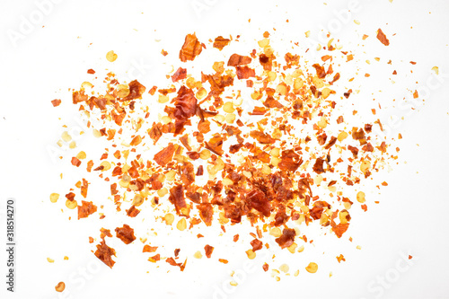 Картината върху платно Red chilly flakes top view isolated on white background with clipping path