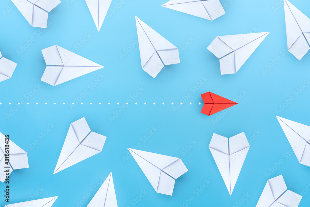 Small business concept with small red paper plane on blue background Small business concept with small red paper plane on blue background
