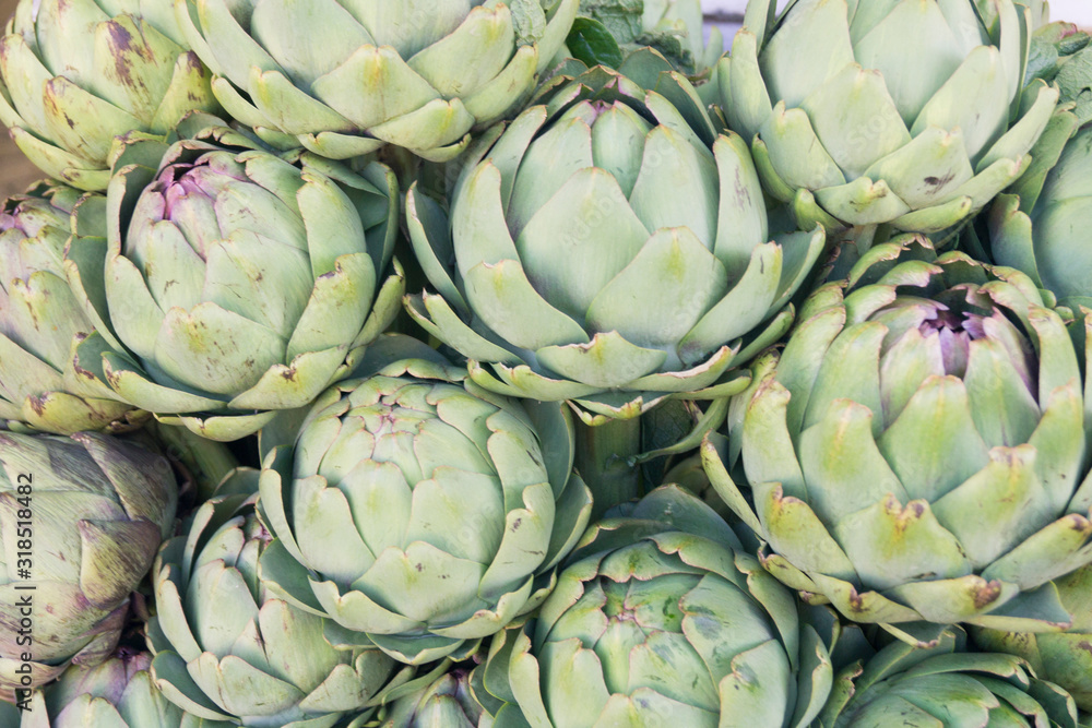 Fototapeta premium ripe artichoke on counter close-up