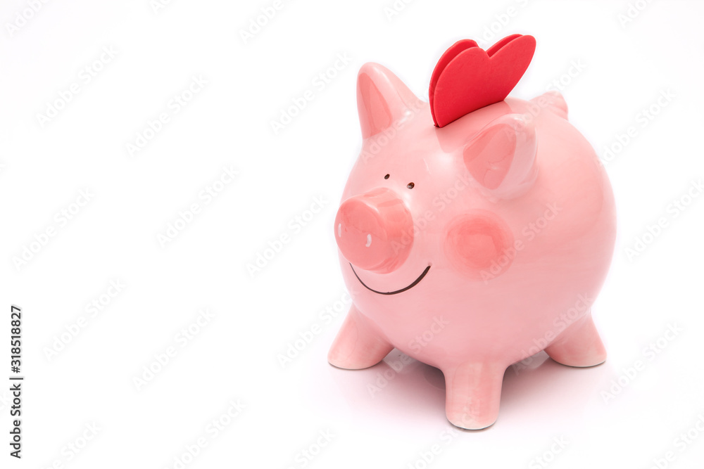 Two red heartas on a piggy bank