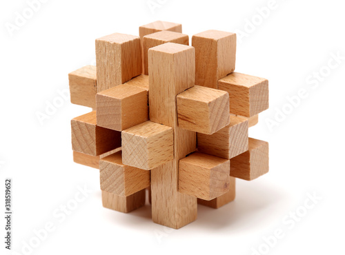 wooden puzzle over white background