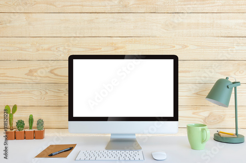 Computer with blank white copy space for text and wood background, Mockup design desktop computer in office on white table with keyboard and Coffee cub, Work place concept, Cactus in pot.