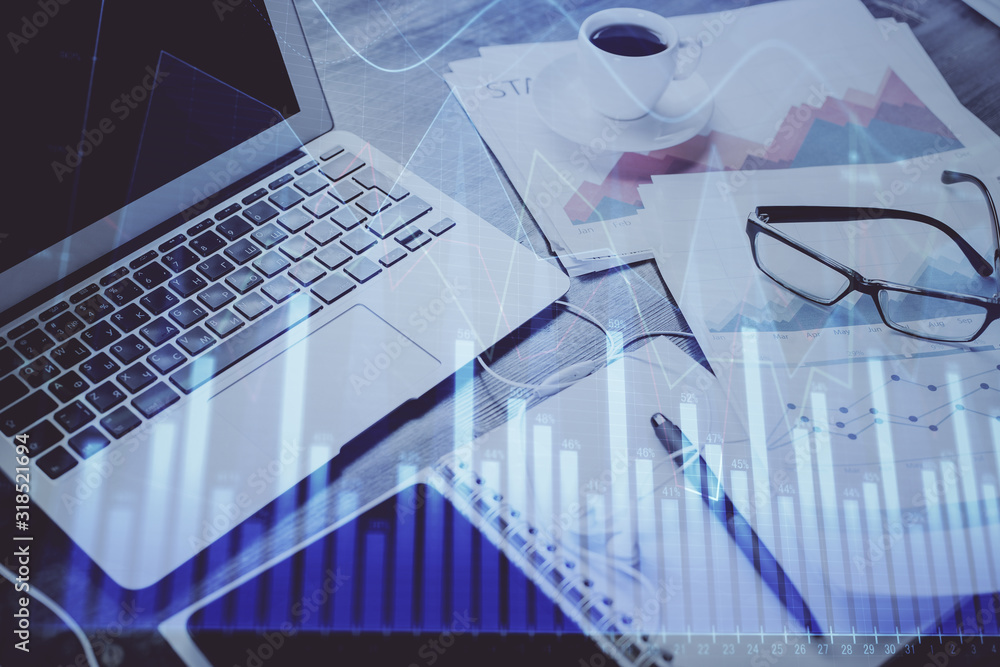Forex Chart hologram on table with computer background. Double exposure. Concept of financial markets.