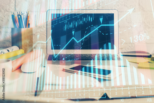 Stock market graph and table with computer background. Multi exposure. Concept of financial analysis. © peshkova