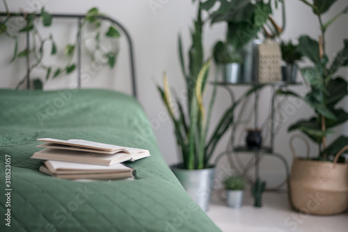 cosy light bedroom with tropical flowers decoration