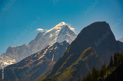 Mt.Dunagiri (elevation 7,066 m ) visible on the way to Bhavishya Badri. Mt. Dunagiri is one of the high peaks of the Chamoli District Himalayas in the northern Indian state of Uttarakhand.