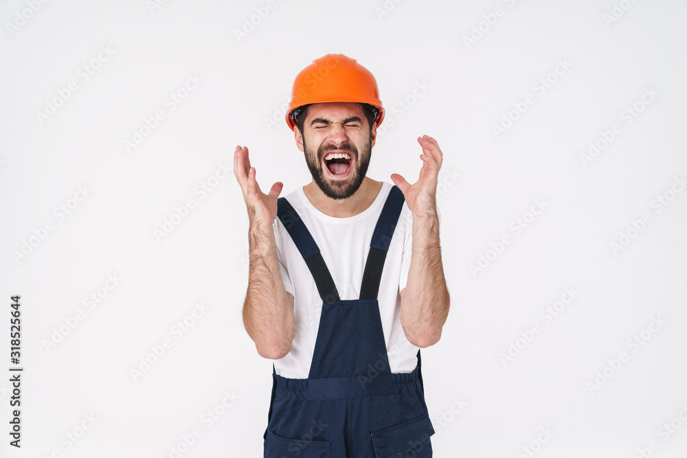 Stressful young man builder in helmet Stressful young man builder in helmet